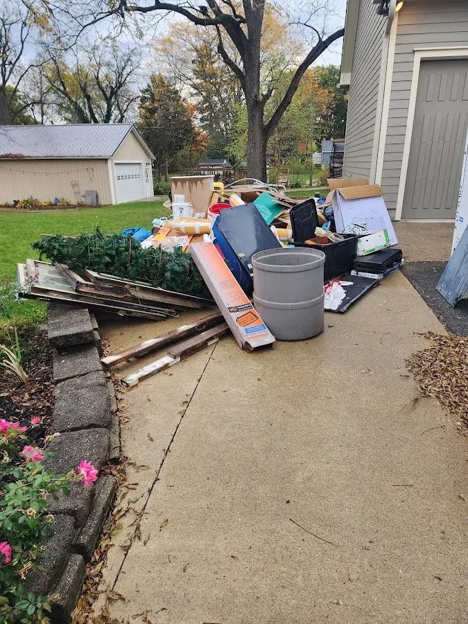 Dumpster being loaded with debris for Demolition Dumpster Rental in Buckeye